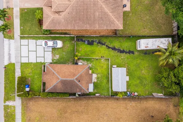 an aerial view of a house with a garden