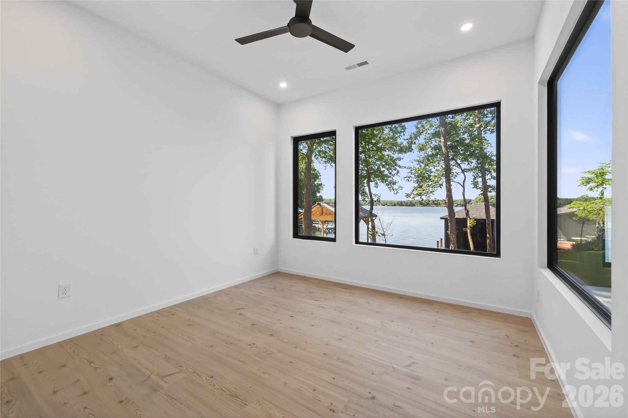 115 High Shores Road Norwood, NC 28128 - Photo 21 of 30 a view of an empty room with a window
