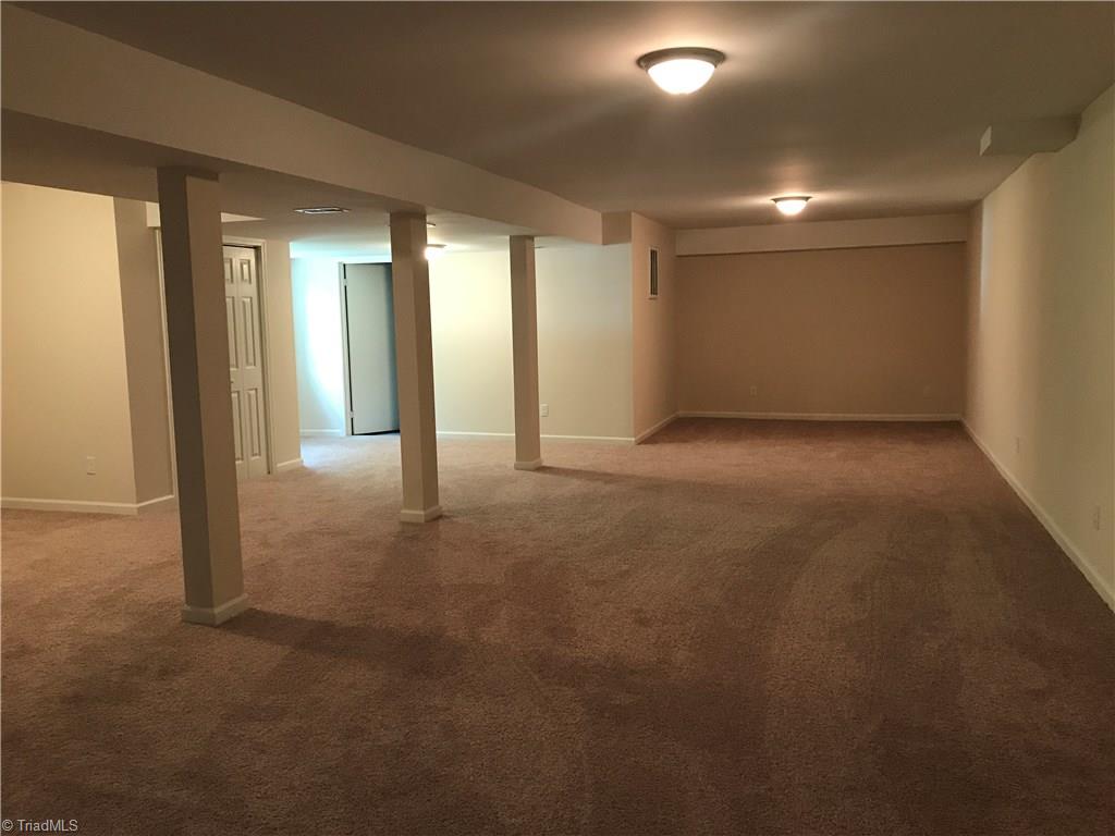 162 Merrigold Road Reidsville, NC 27320 - Photo 11 of 12 Finished basement, with laundry room and storage or workroom. Accessible to outside.