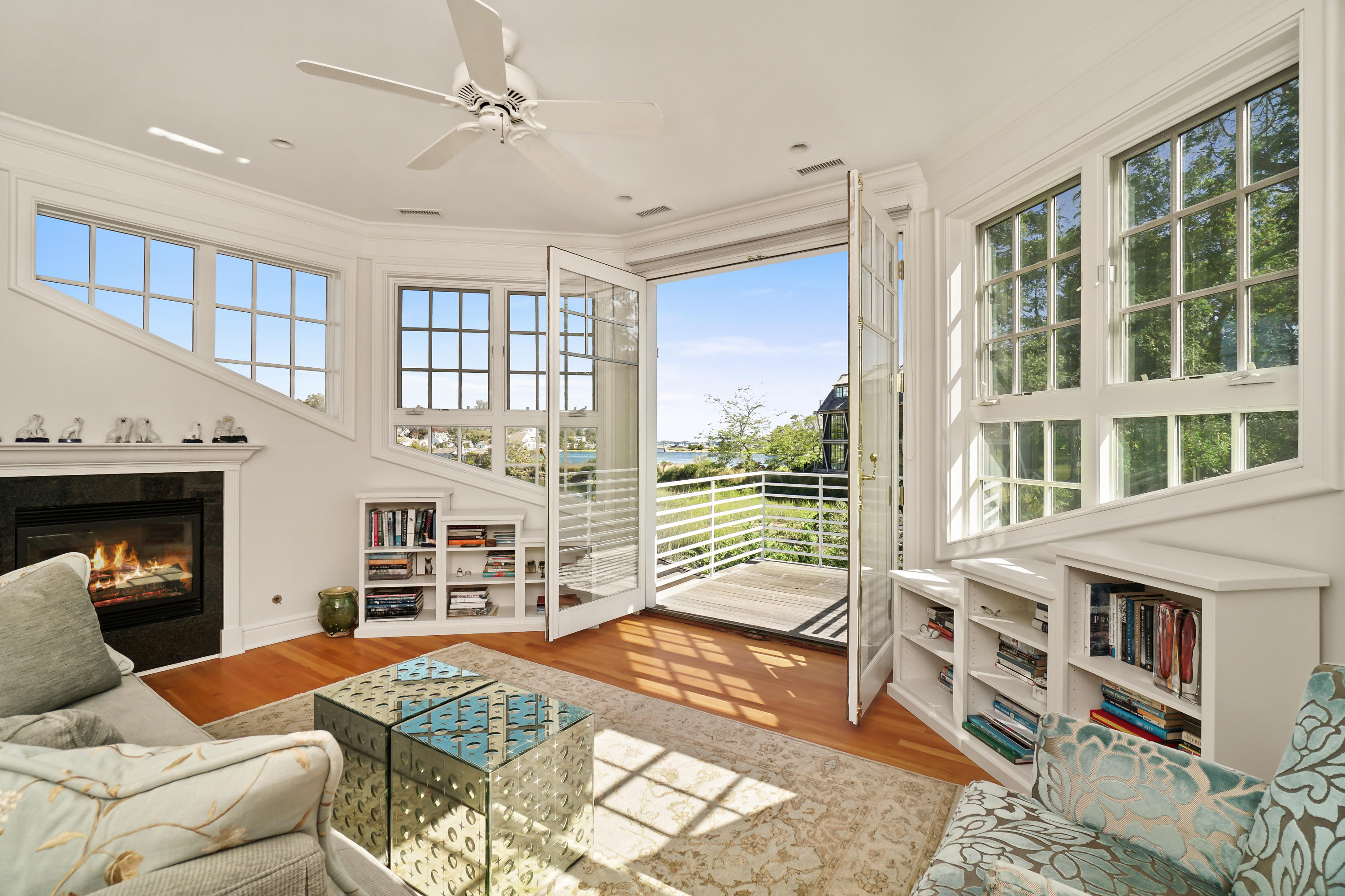 22 Pine Point Road Rowayton, CT 06853 - Photo 13 of 26 a living room with furniture a fireplace and a large window