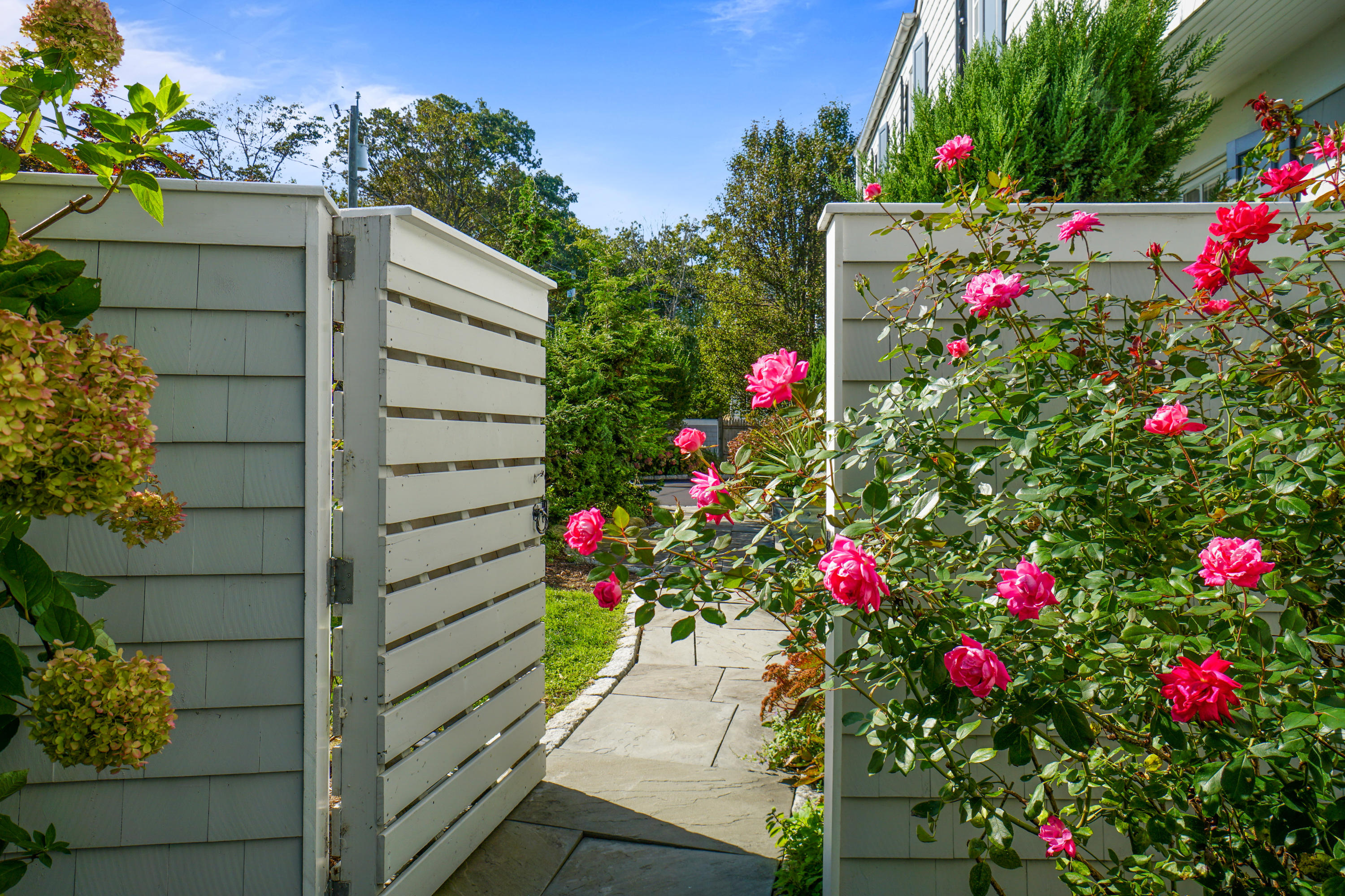 22 Pine Point Road Rowayton, CT 06853 - Photo 20 of 26 a view of flower garden with wooden fence
