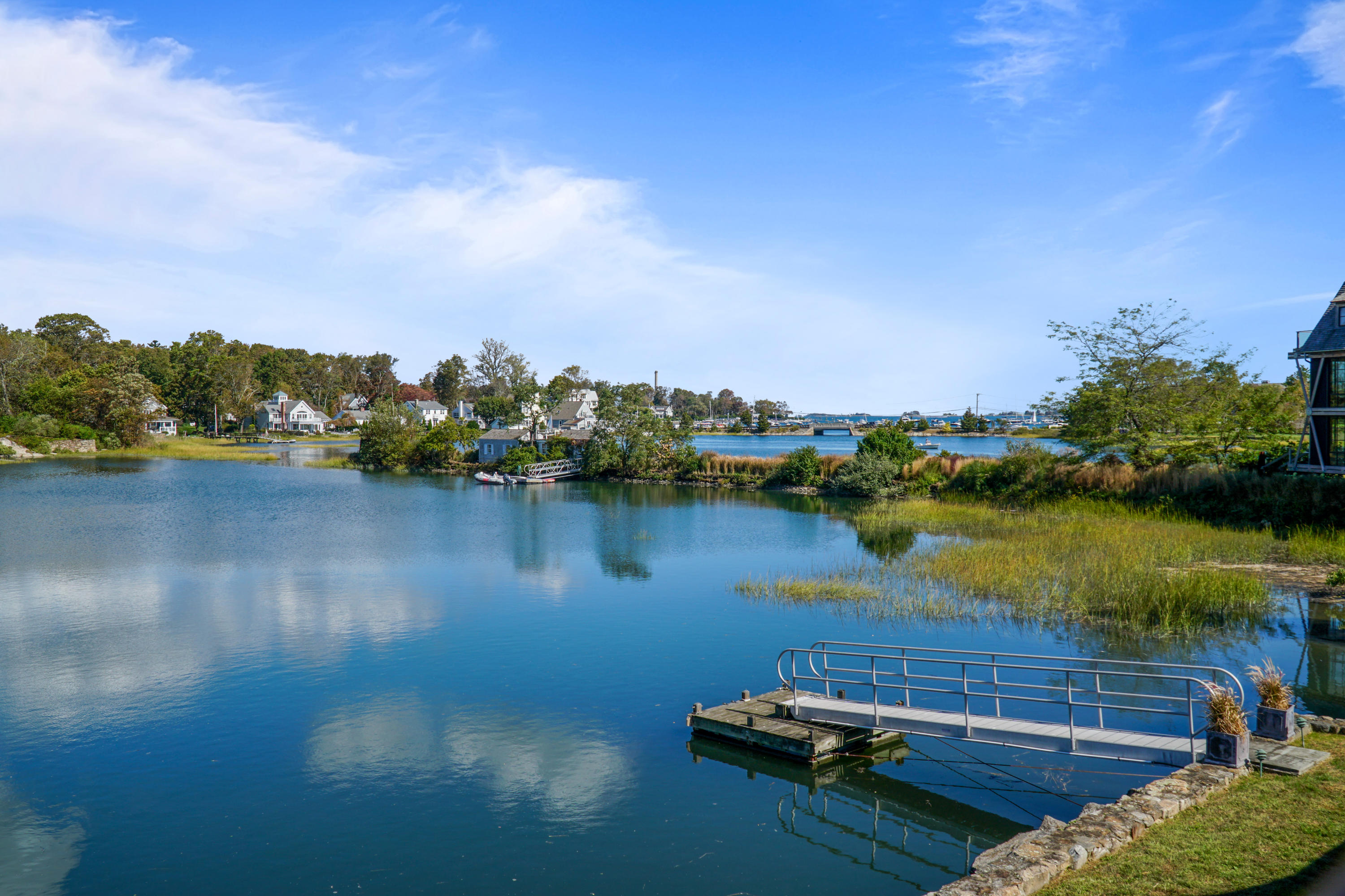 22 Pine Point Road Rowayton, CT 06853 - Photo 21 of 26 a view of a lake with houses in the back