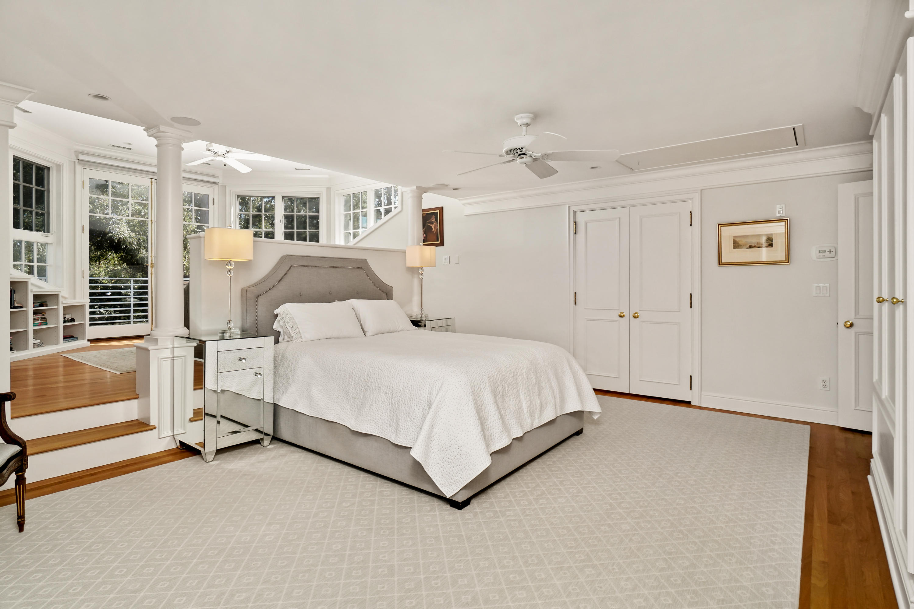 22 Pine Point Road Rowayton, CT 06853 - Photo 25 of 26 a bedroom with a large bed and a chandelier