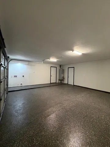 a room with furniture and white walls