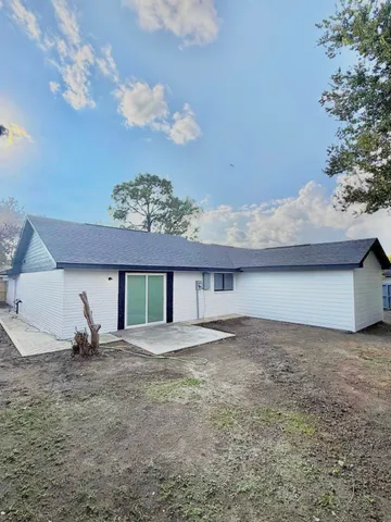 a view of a house with a yard and garage