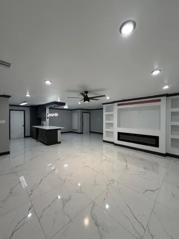 a view of room with window and fireplace