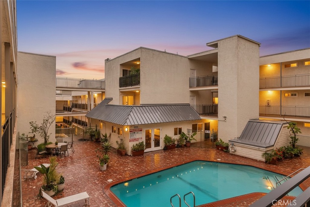 9005 Cynthia Street, Unit 317 West Hollywood, CA 90069 - Photo 1 of 23 a balcony with furniture and a potted plant