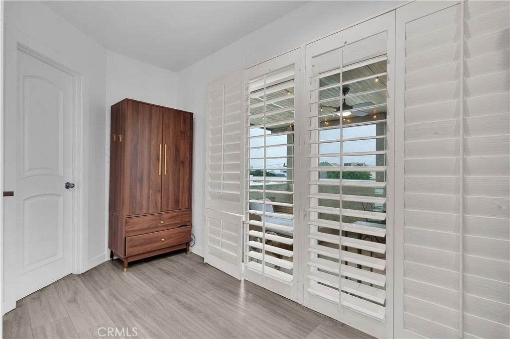 9005 Cynthia Street, Unit 317 West Hollywood, CA 90069 - Photo 11 of 23 a view of walk in closet with clothes and shoes