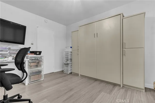 a view of a livingroom with furniture and a flat screen tv