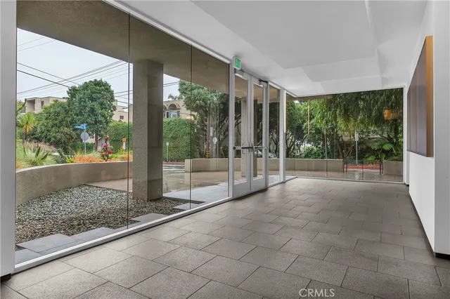 a view of a room with porch and wooden floor