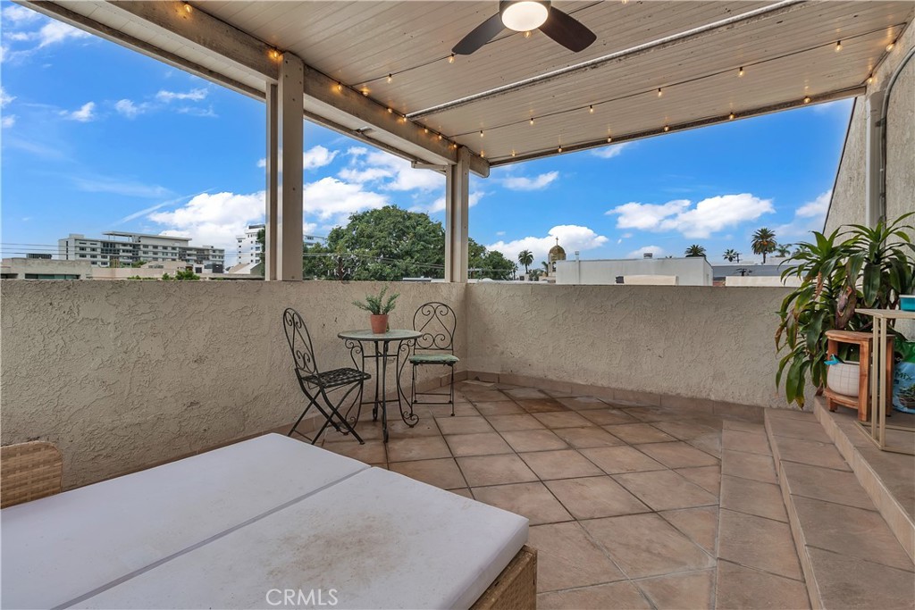 9005 Cynthia Street, Unit 317 West Hollywood, CA 90069 - Photo 21 of 23 a view of a chairs and table in the balcony
