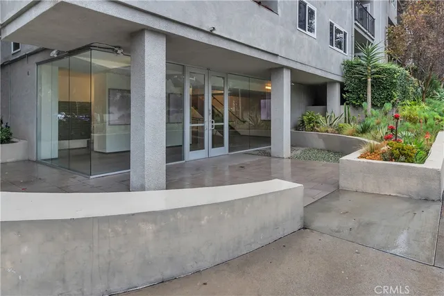 front view of a house with potted plants and a potted plant
