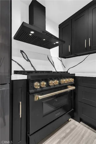 a kitchen with a stove and a microwave
