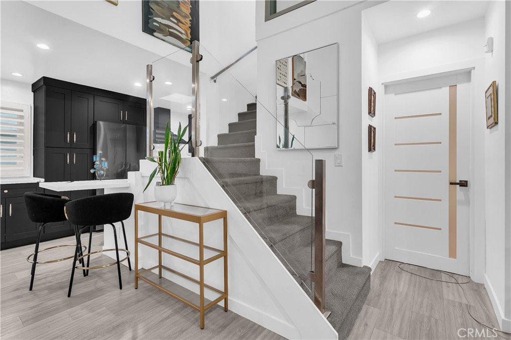 9005 Cynthia Street, Unit 317 West Hollywood, CA 90069 - Photo 7 of 23 a living room with furniture and a wooden floor