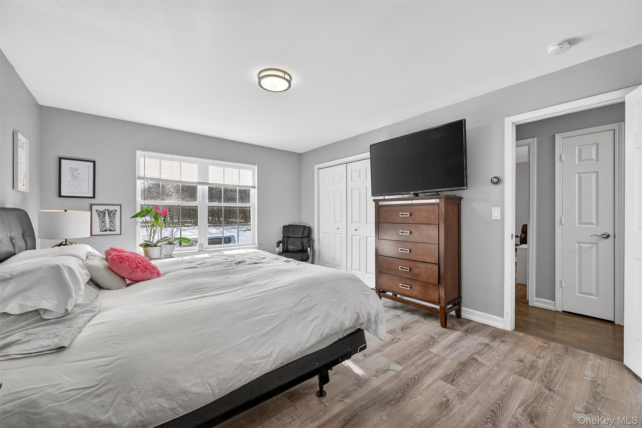508 Walker Valley Road Pine Bush, NY 12566 - Photo 13 of 26 a bedroom with a bed and a flat screen tv