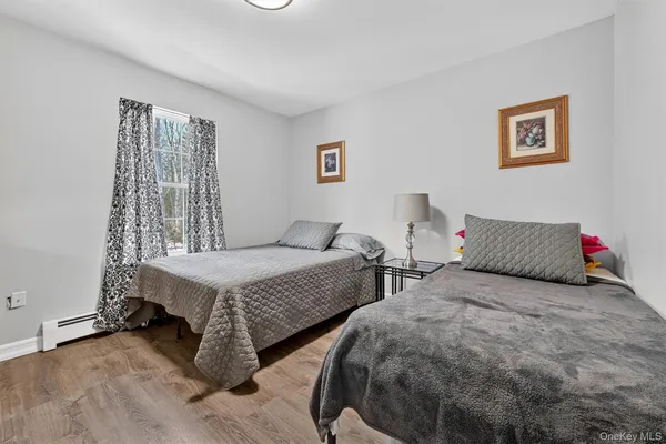 a bedroom with two beds and painted walls