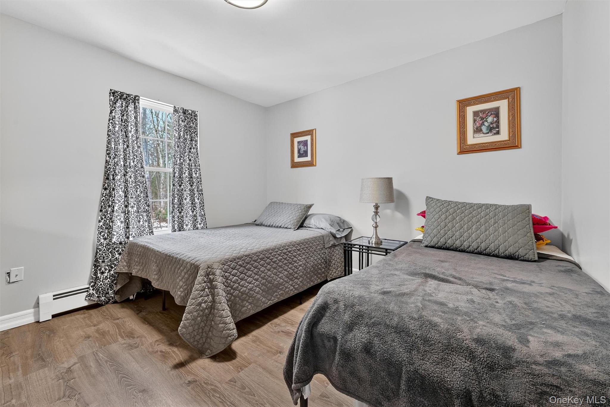 508 Walker Valley Road Pine Bush, NY 12566 - Photo 15 of 26 a bedroom with two beds and painted walls