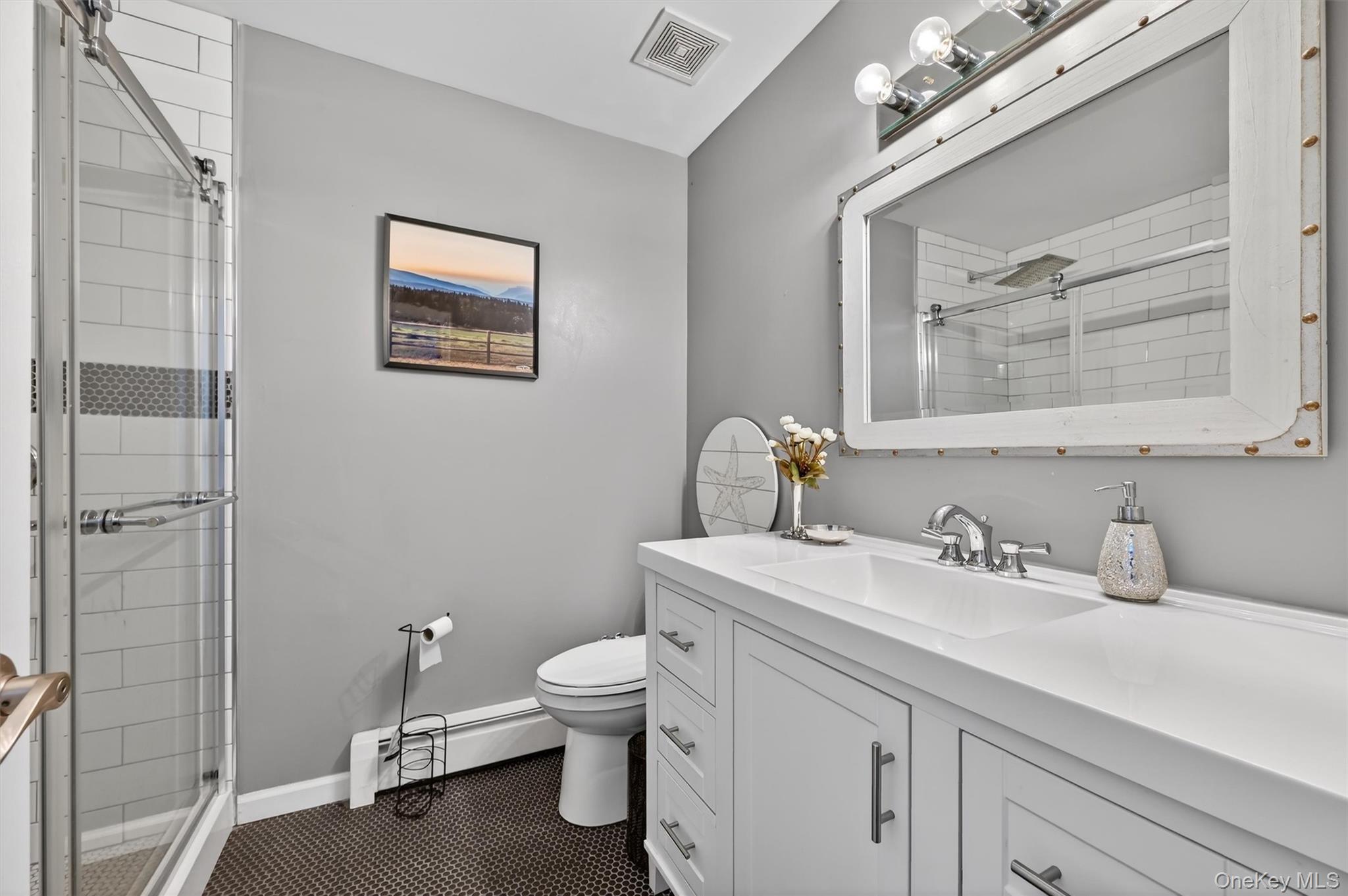 508 Walker Valley Road Pine Bush, NY 12566 - Photo 17 of 26 a bathroom with a toilet sink and mirror