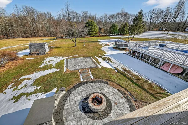 a view of swimming pool with outdoor seating and yard