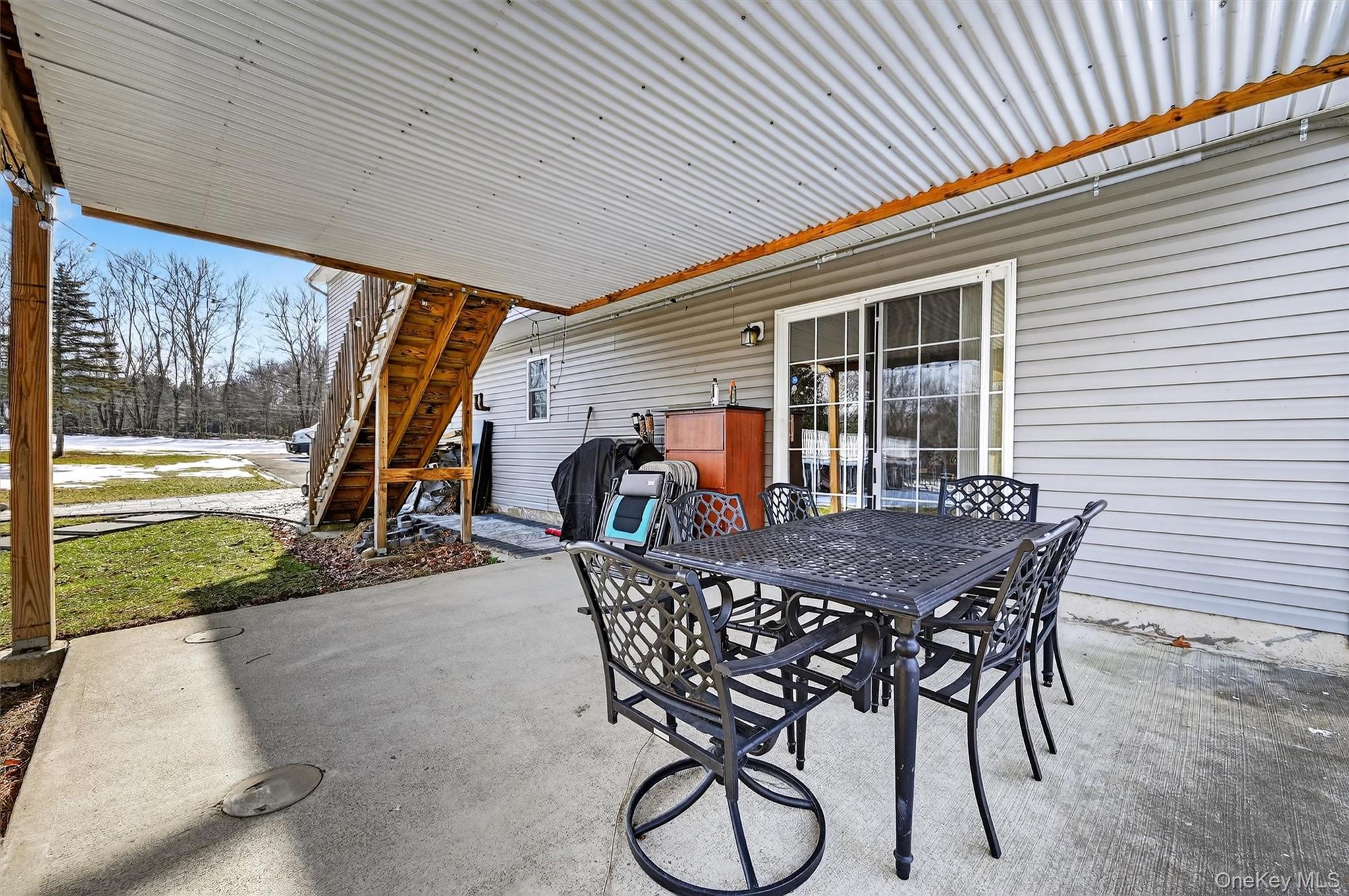 508 Walker Valley Road Pine Bush, NY 12566 - Photo 26 of 26 a view of a patio with table and chairs with wooden floor and fence