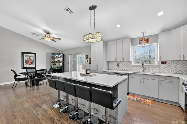 a very nice looking dining room with a table and chairs