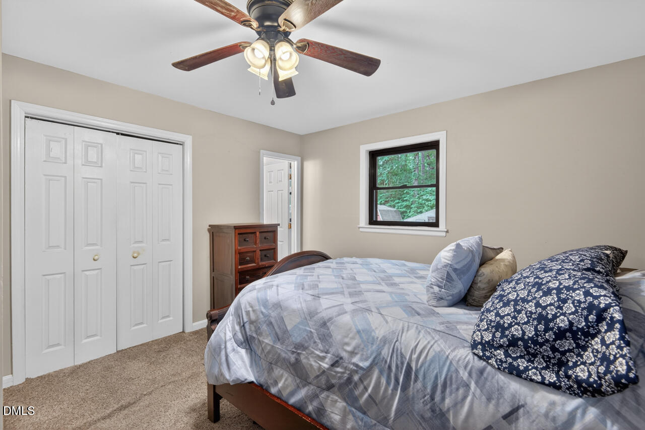 1420 Goodwin Road Durham, NC 27712 - Photo 26 of 54 a bedroom with a bed and a window