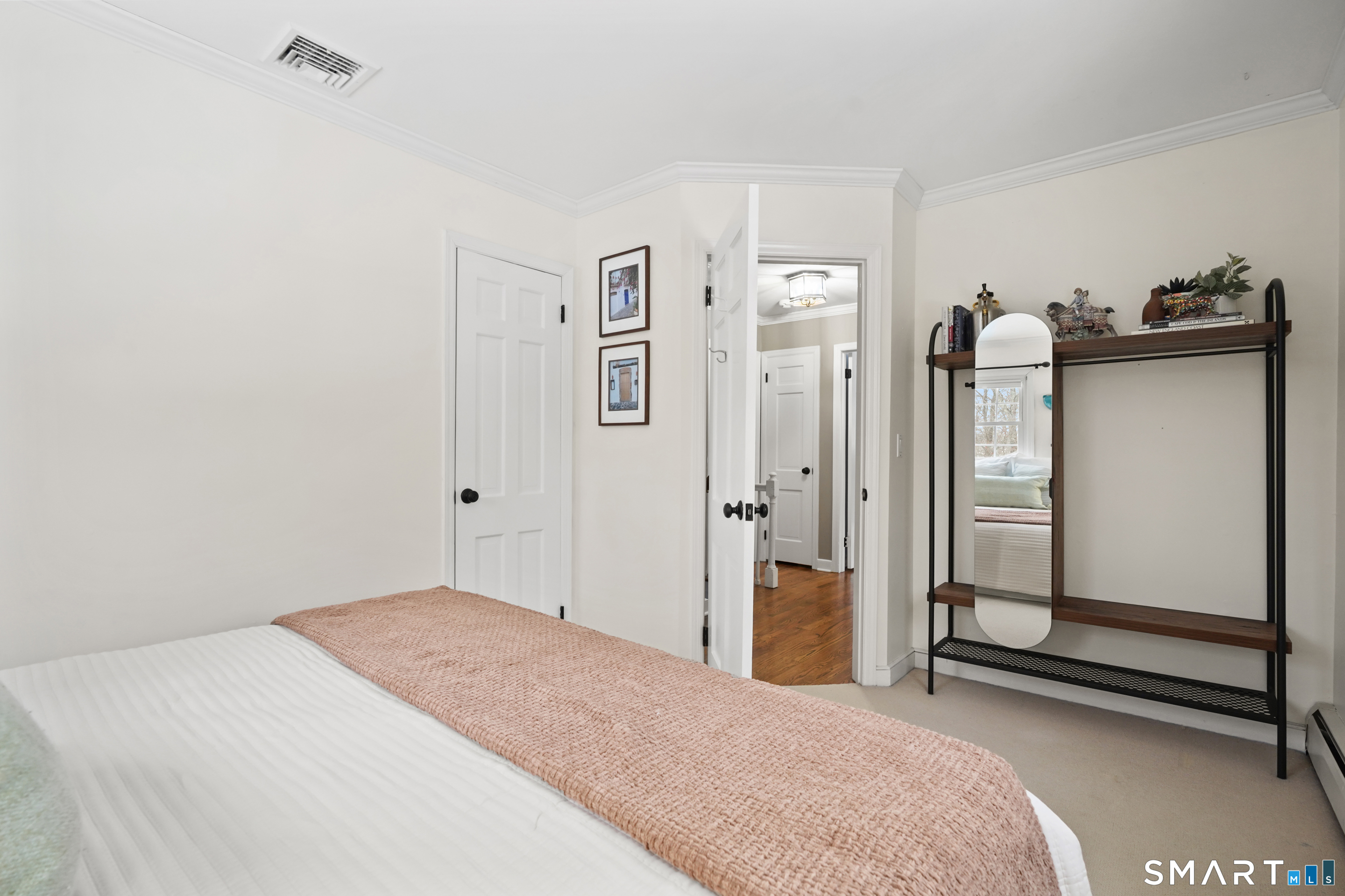 349 Mountain Road Wilton, CT 06897 - Photo 15 of 33 a bedroom with a bed and a dresser