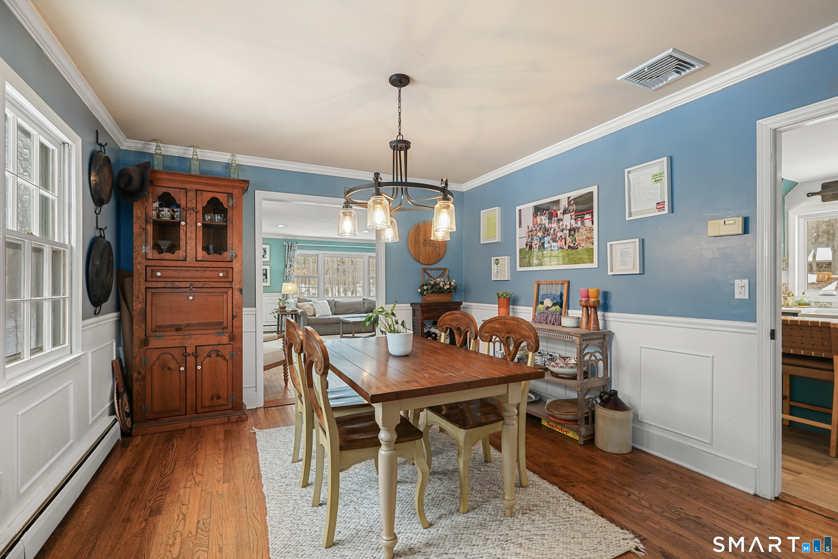 349 Mountain Road Wilton, CT 06897 - Photo 2 of 33 a view of a dining room with furniture window and wooden floor