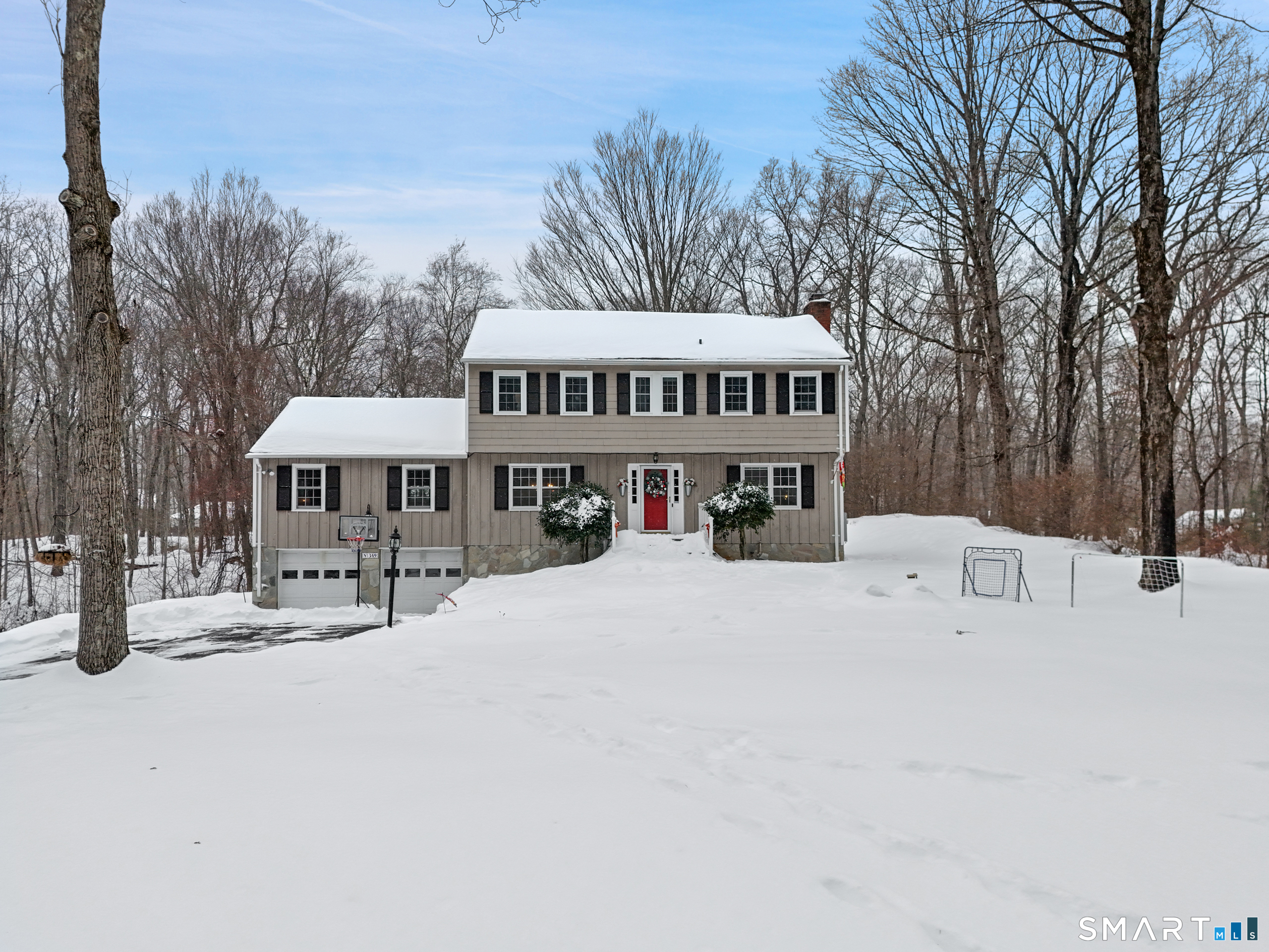 349 Mountain Road Wilton, CT 06897 - Photo 29 of 33 a front view of a house with a yard and trees