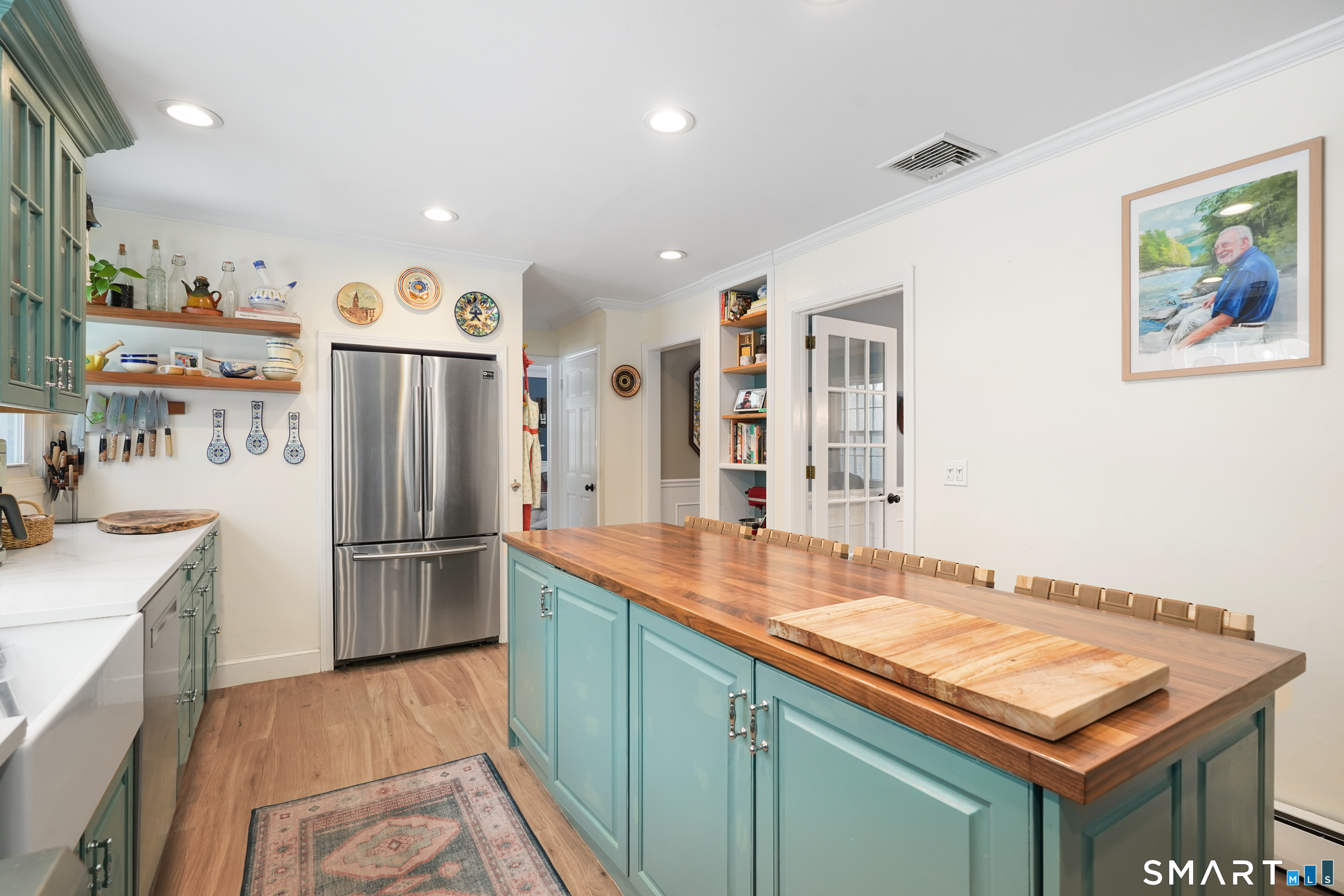 349 Mountain Road Wilton, CT 06897 - Photo 6 of 33 a kitchen with refrigerator and cabinets