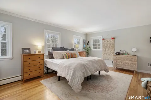 a bed room with a bed and a dresser