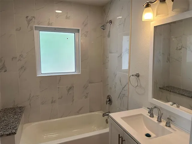 a bathroom with a shower and toilet
