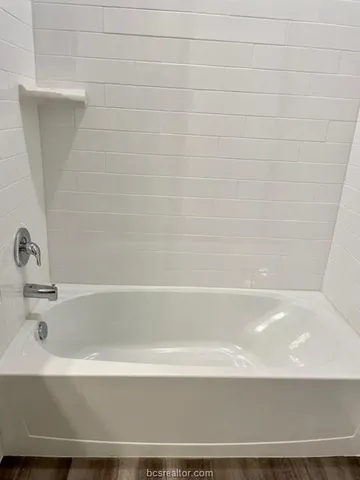 a bathroom with bathtub