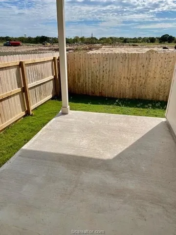 a view of a backyard with a tub