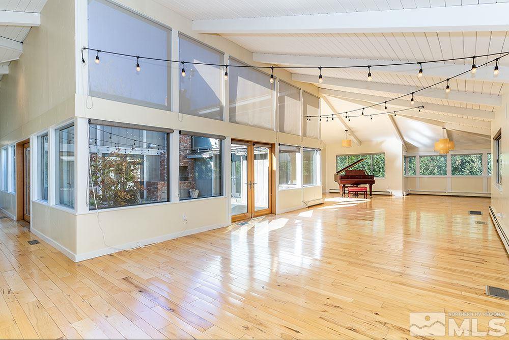 1755 Berkeley Drive Reno, NV 89509 - Photo 4 of 33 a view of empty room with wooden floor and windows