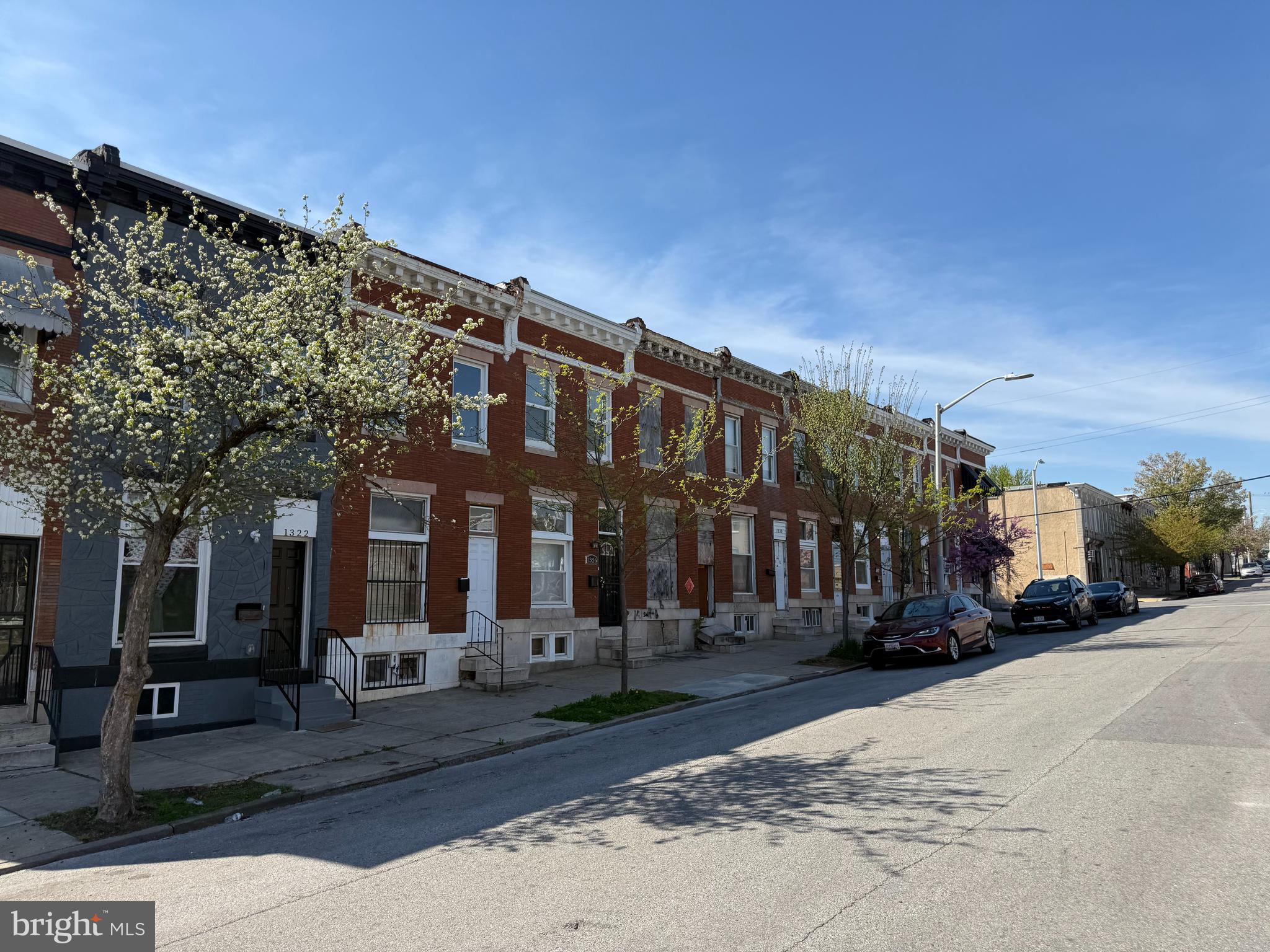 1306 North Luzerne Avenue Baltimore, MD 21213 - Photo 3 of 3 a street view along with residential building