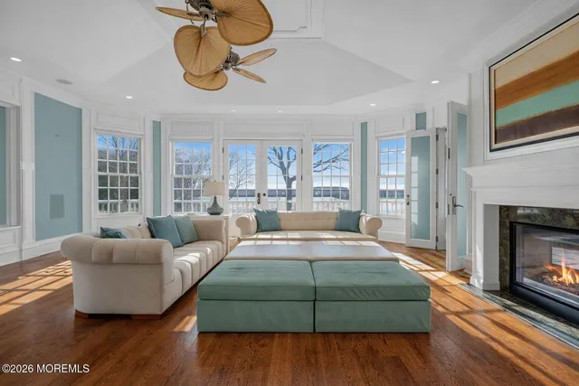 a spacious bedroom with a large bed and a fireplace