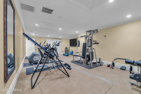 a living room with fireplace furniture and a large window