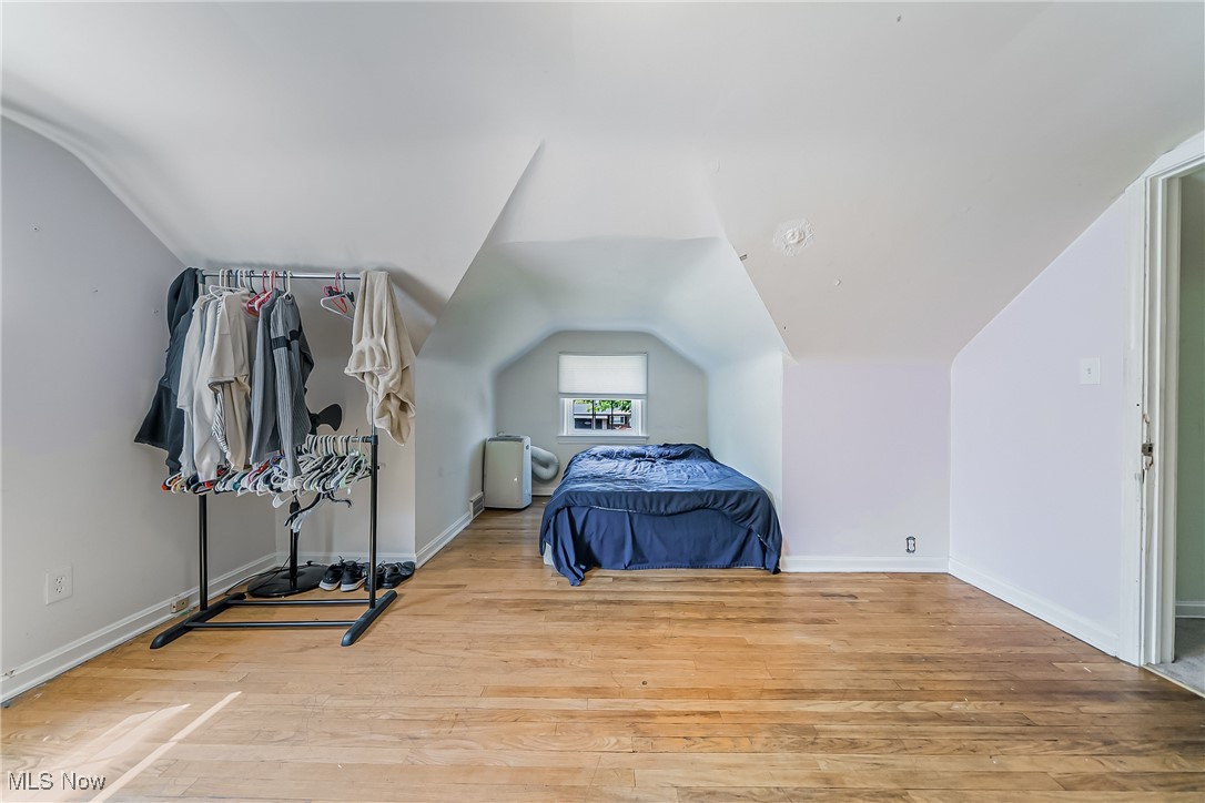 1607 Richmond Road Cleveland, OH 44124 - Photo 19 of 32 Bedroom with light hardwood / wood-style floors and vaulted ceiling