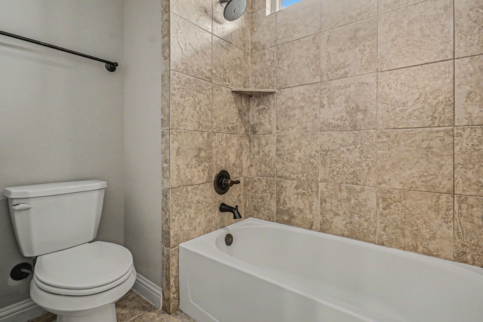 3310 Ralston Edge Lane Houston, TX 77059 - Photo 42 of 50 a bathroom with a toilet and bathtub