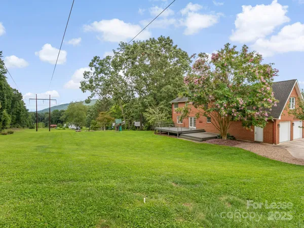 a backyard of a house with lots of green space