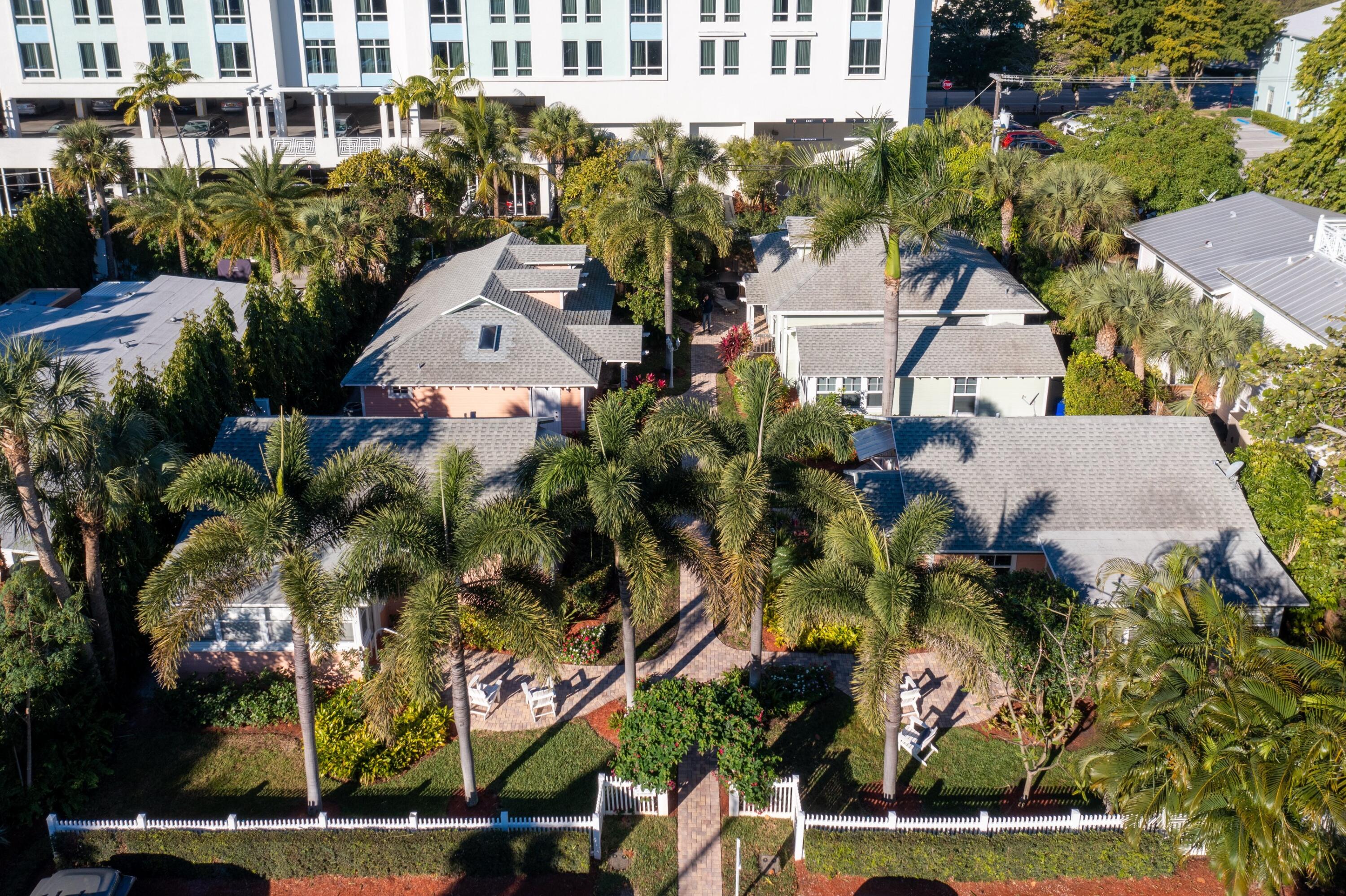 118 Southeast 7th Avenue Delray Beach, FL 33483 - Photo 16 of 17 an aerial view of a house with a yard and large trees