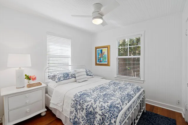 a bedroom with a bed and a window with the outer view