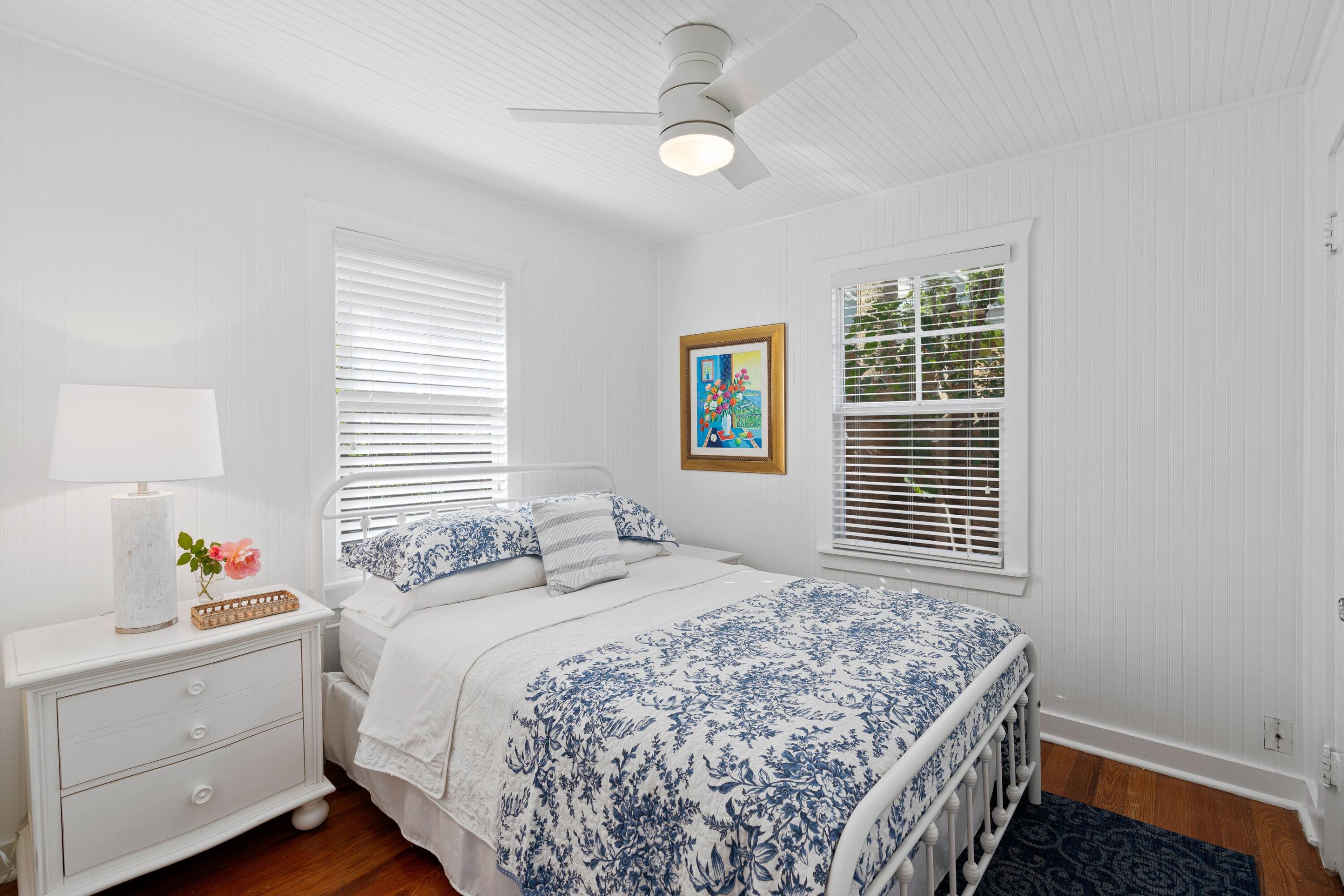 118 Southeast 7th Avenue Delray Beach, FL 33483 - Photo 8 of 17 a bedroom with a bed and a window with the outer view