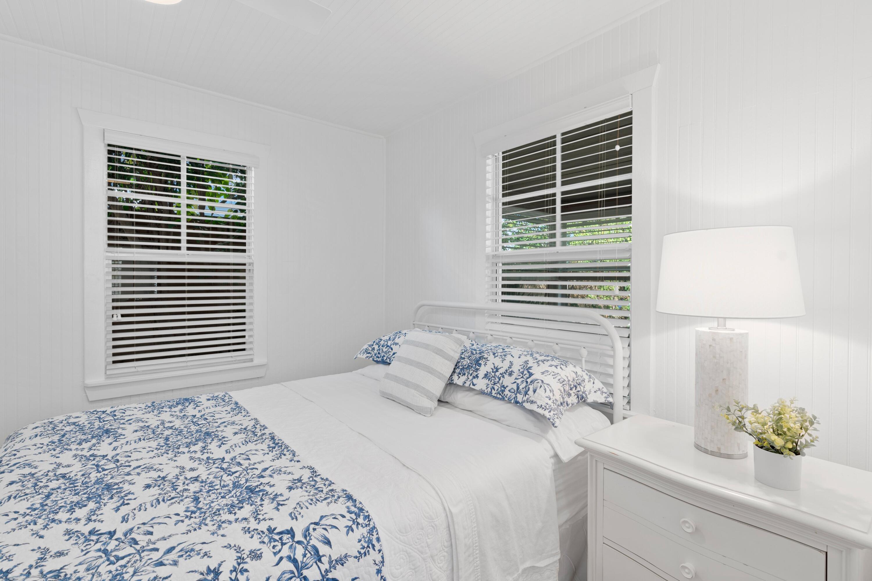 118 Southeast 7th Avenue Delray Beach, FL 33483 - Photo 10 of 17 a bedroom with a bed and a window