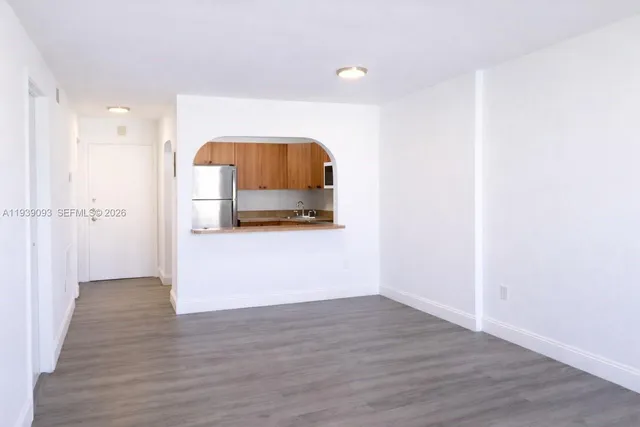 a view of a utility room with wooden floor