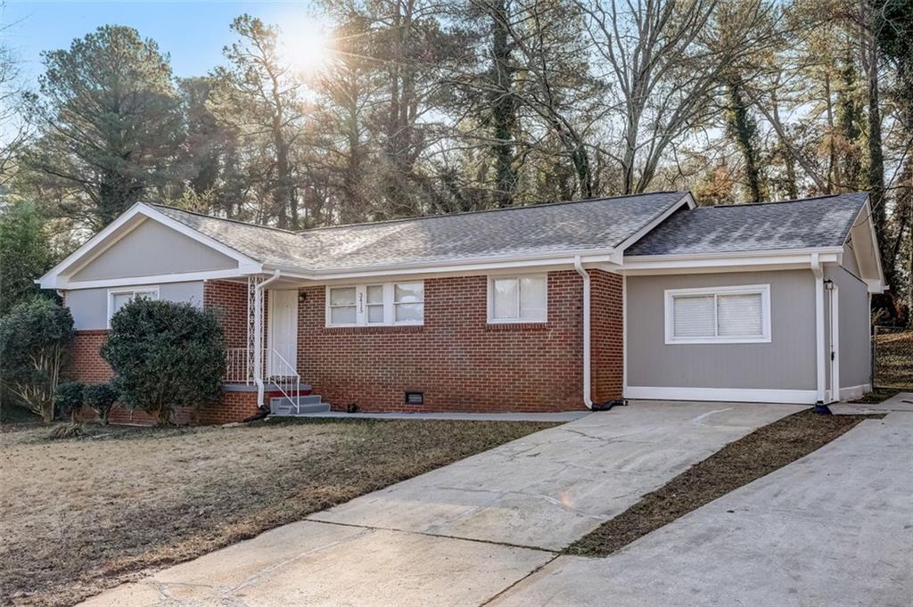 3415 Springlake Drive Decatur, GA 30032 - Photo 1 of 1 a front view of a house with a garden