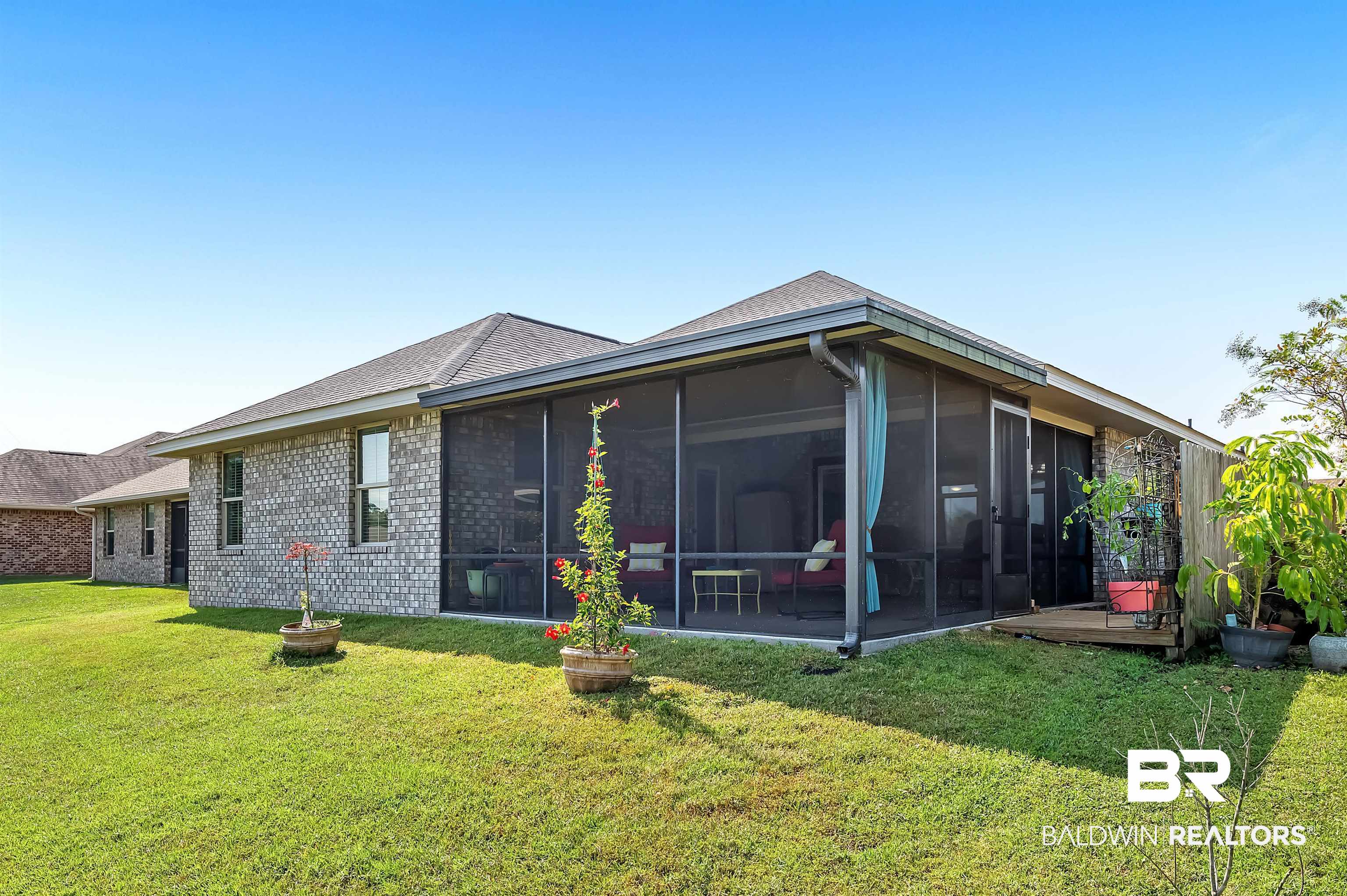 8896 Allay Lane Foley, AL 36535 - Photo 7 of 57 Back of house featuring a lawn and a sunroom
