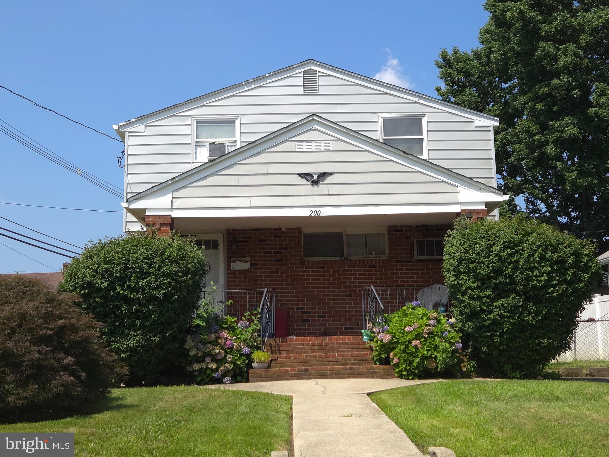 200 East Roland Road Brookhaven, PA 19015 - Photo 1 of 47 a front view of a house with a yard