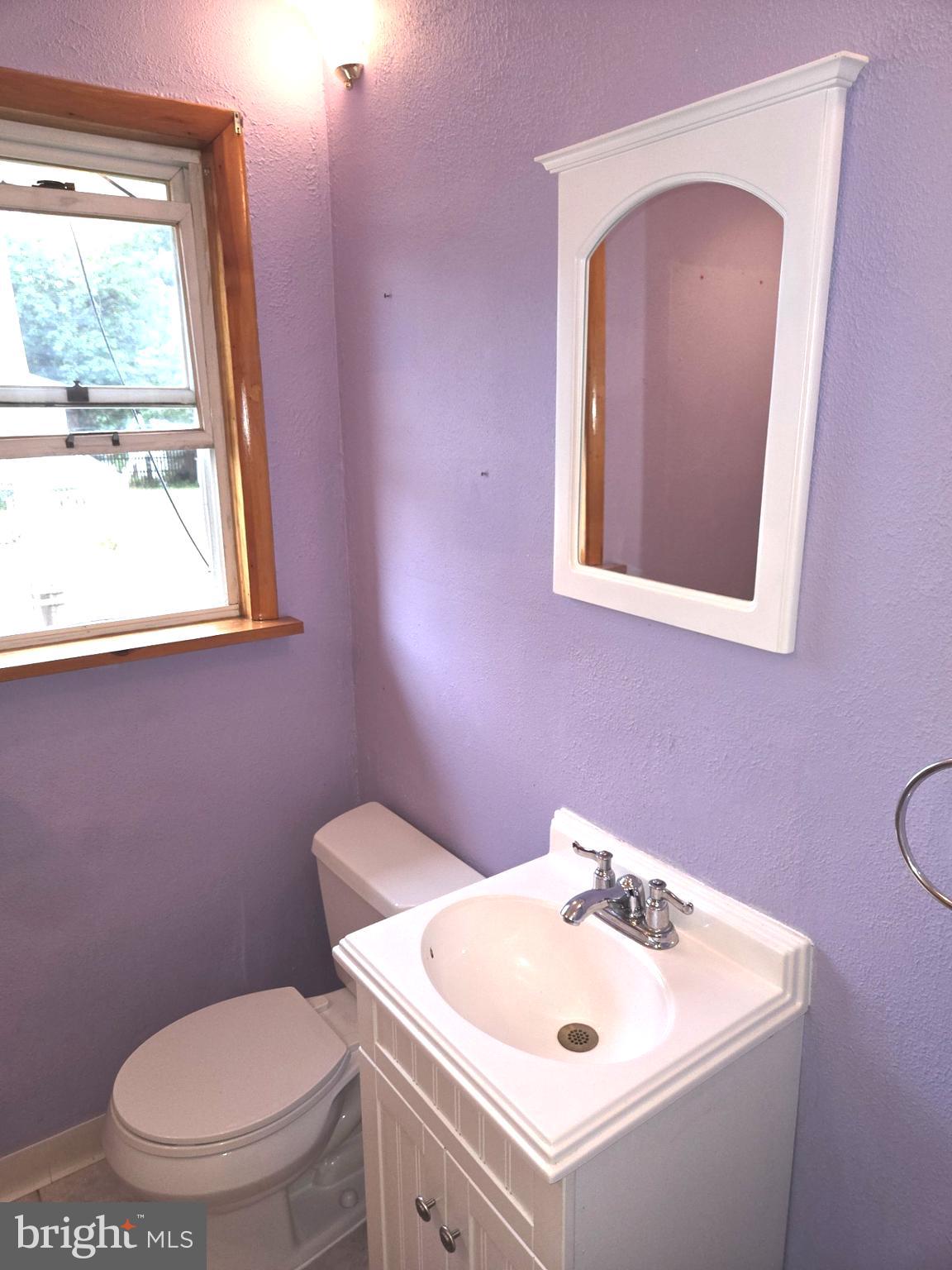 200 East Roland Road Brookhaven, PA 19015 - Photo 11 of 47 a bathroom with a toilet sink and mirror